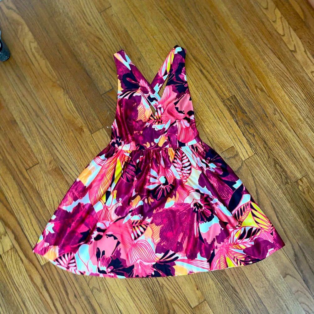Colorful print Babydoll style dress, straps criss-cross in the back.